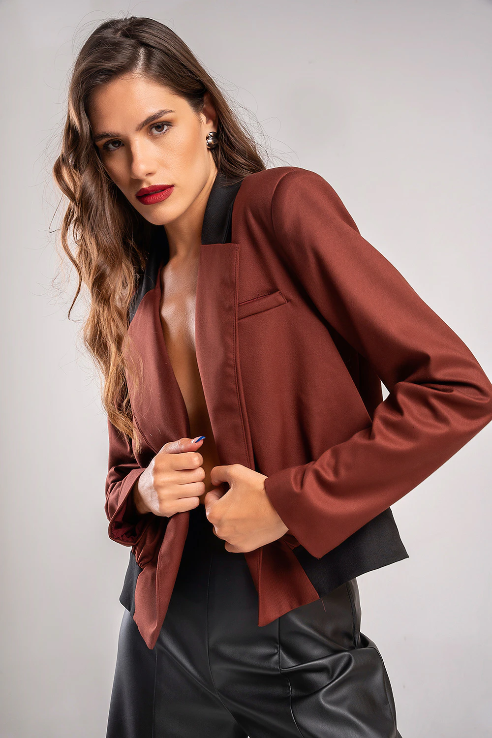 Teta Arvanitaki Character Ginger Jacket with a contrasting black collar and chest welt pocket, angled front view