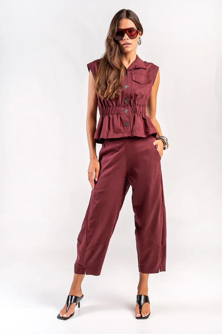 Teta Arvanitaki Avocado Wine Pants and Avocado Wine Shirt, front view showing the curved trouser legs and sleeveless button-front shirt