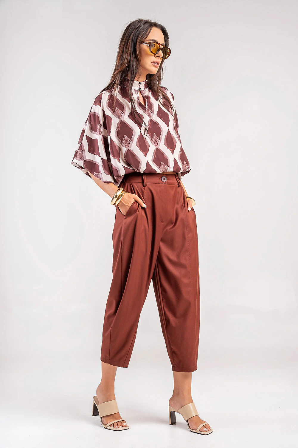 Teta Arvanitaki Capri Ginger Shirt and Bari Ginger Pants, three-quarter view with hands in the trouser pockets.