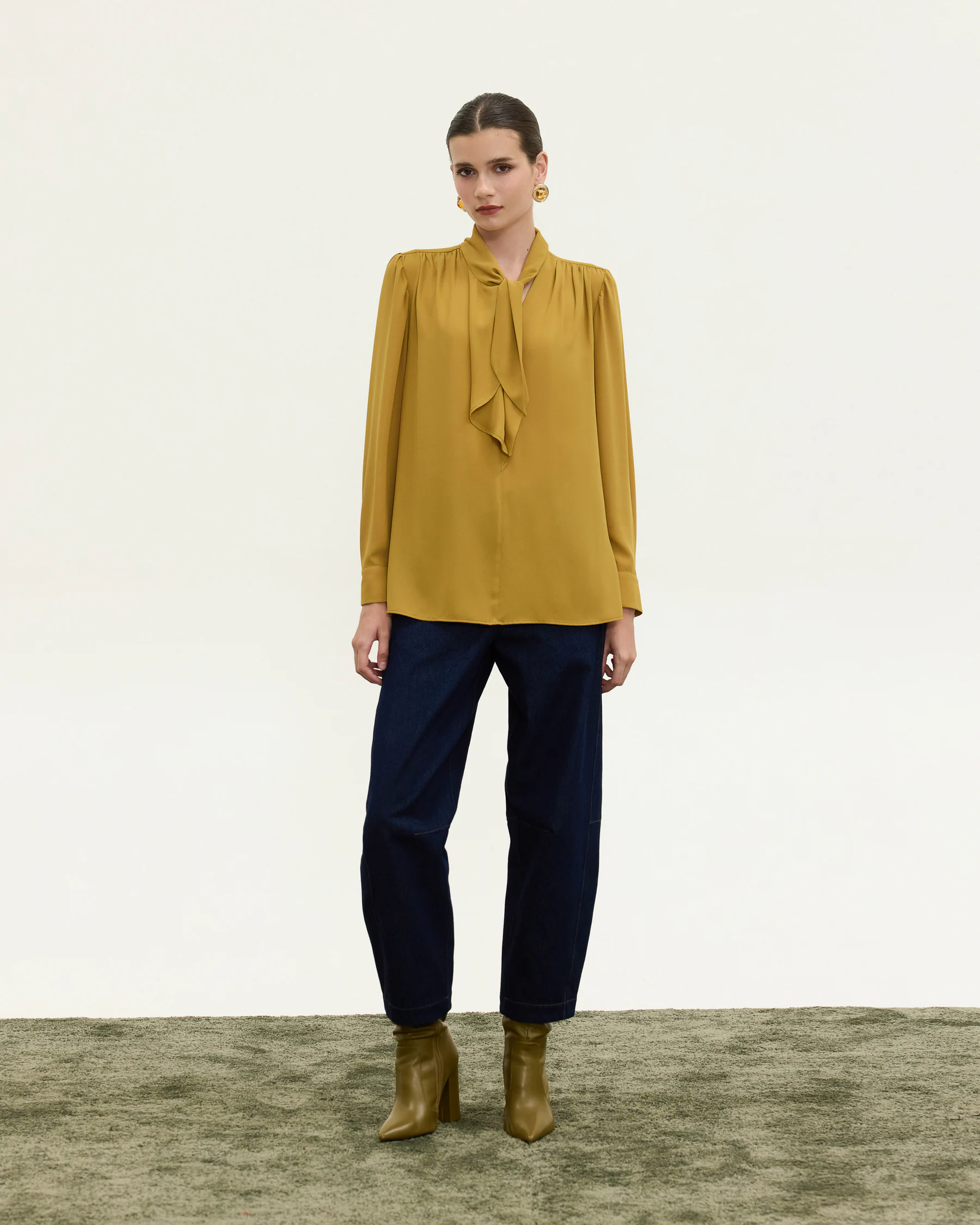 Innocent Estelle Tie-Neck Top in ochre on model, front view showing neck tie and long sleeves