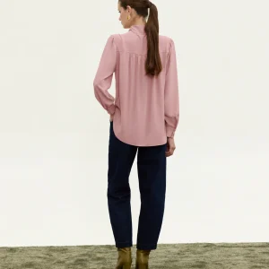 Innocent Estelle Tie-Neck Top in pink on model, back view showing gathered back and long sleeves