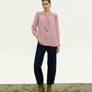 Innocent Estelle Tie-Neck Top in dirty pink on model, front view showing neck tie and long sleeves